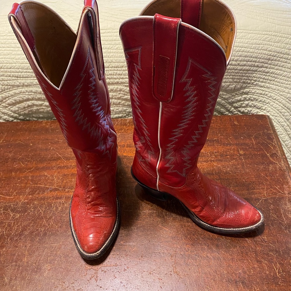 Handmade red boots with riding heel.